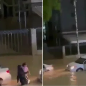 شاهد.. فتاة توقف سيارتها وتنقذ عائلة من الغرق في سيول عنيزة