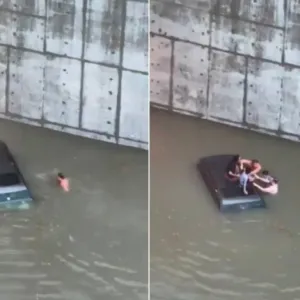 شاهد لحظة إنقاذ موظف بنك مصري لعائلة من الغرق داخل سيارتهم وسط السيول في الإمارات
